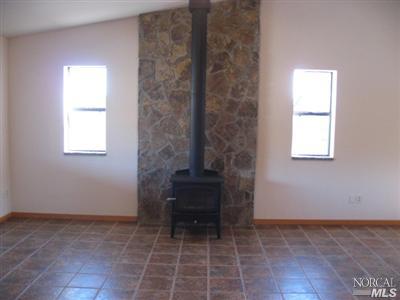 21125 A Loconomi Road Middletown, CA 95461 - Photo 5 of 12 an empty room with windows