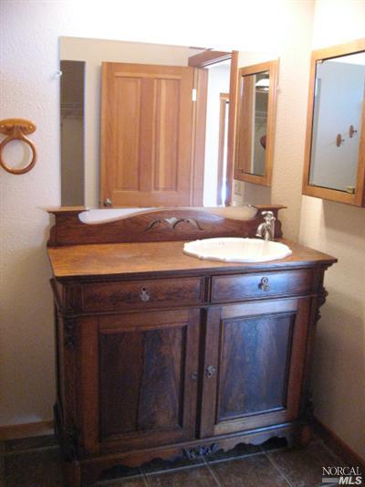 21125 A Loconomi Road Middletown, CA 95461 - Photo 6 of 12 a bathroom with a sink and a mirror