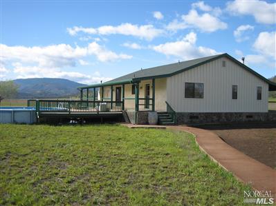 21125 A Loconomi Road Middletown, CA 95461 - Photo 7 of 12 a front view of a house with garden