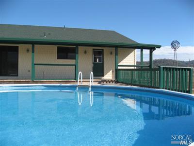 21125 A Loconomi Road Middletown, CA 95461 - Photo 8 of 12 a view of a house with a swimming pool