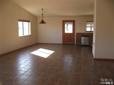 21125 A Loconomi Road Middletown, CA 95461 - Photo 10 of 12 a view of empty room with windows