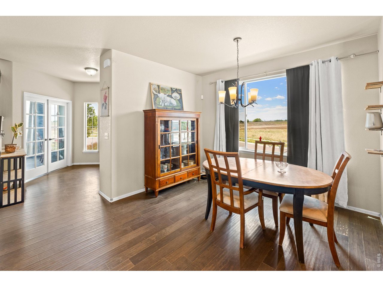 8847 16th St Road Greeley, CO 80634 - Photo 11 of 38 a dining room with furniture window wooden floor