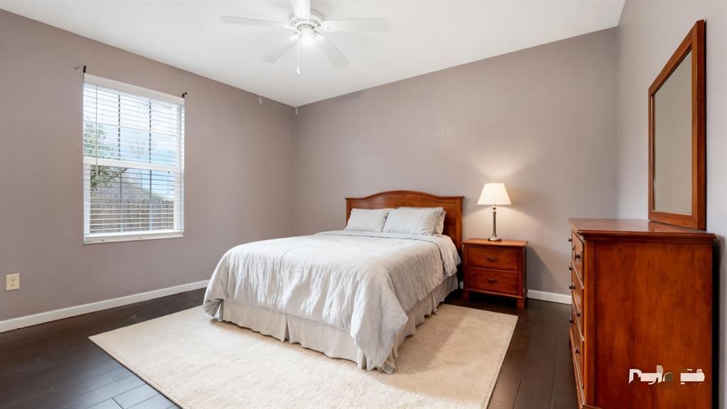 1312 West Connally Street Tyler, TX 75701 - Photo 19 of 33 a bedroom with a bed and a window