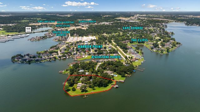 an aerial view of a house with a lake view