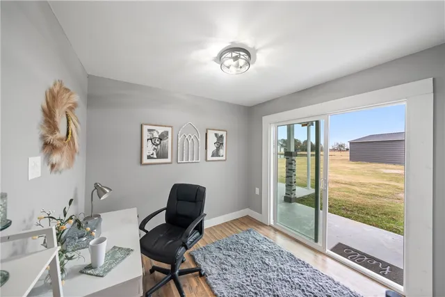 a bathroom with a granite countertop toilet and a sink