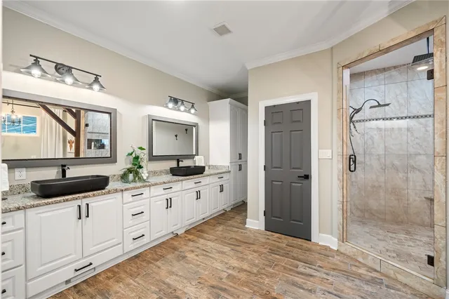 a view of a bathroom with a bathtub and windows