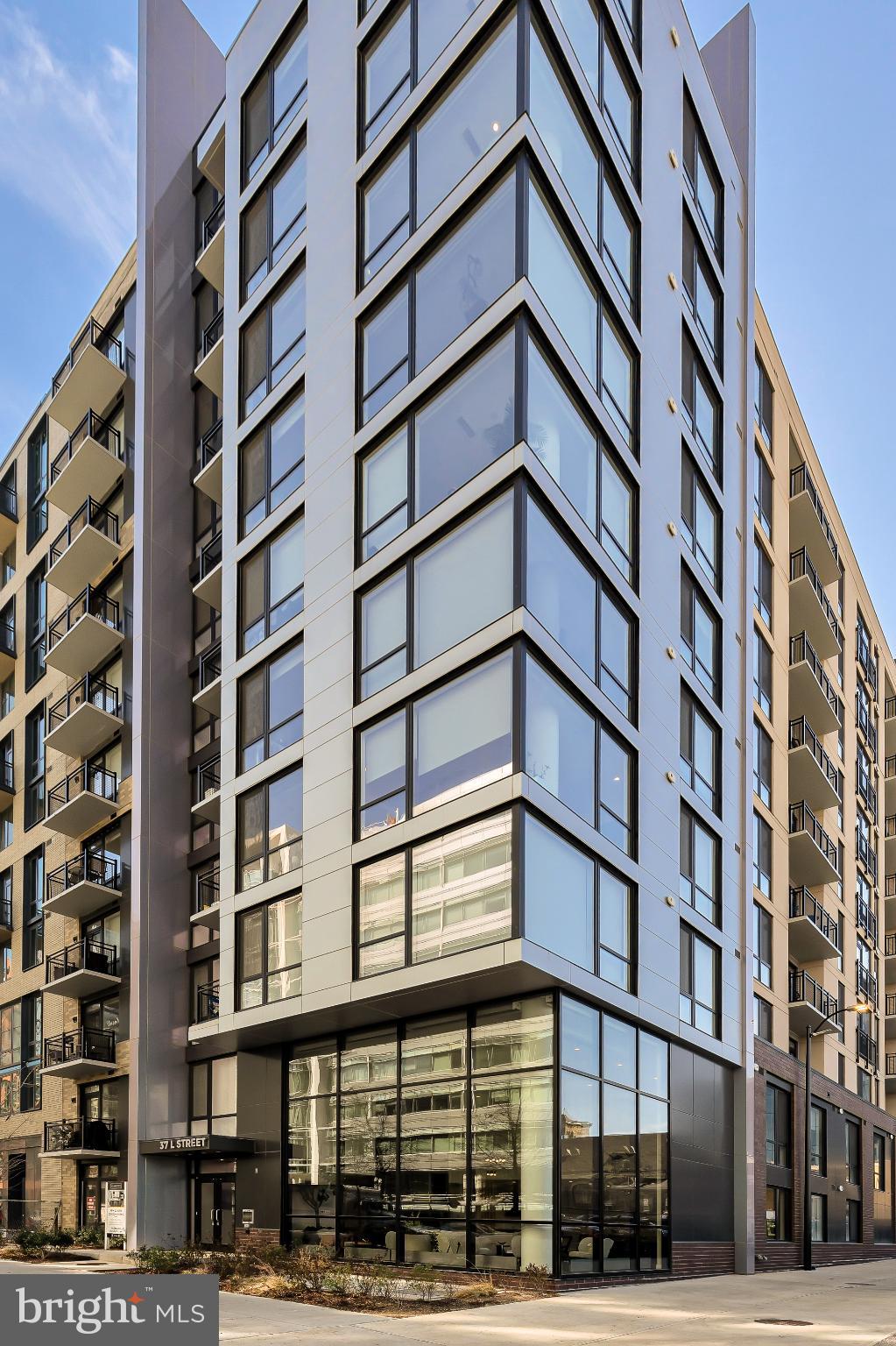 37 L Street Southeast, Unit 308 Washington, DC 20003 - Photo 2 of 43 front view of a building with a street