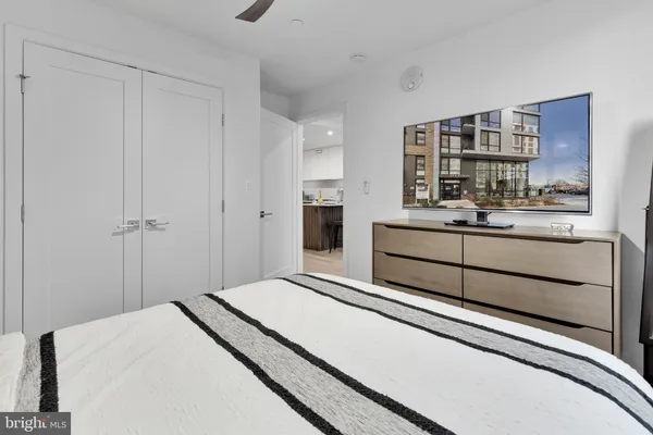 a bedroom with a bed and a book shelf