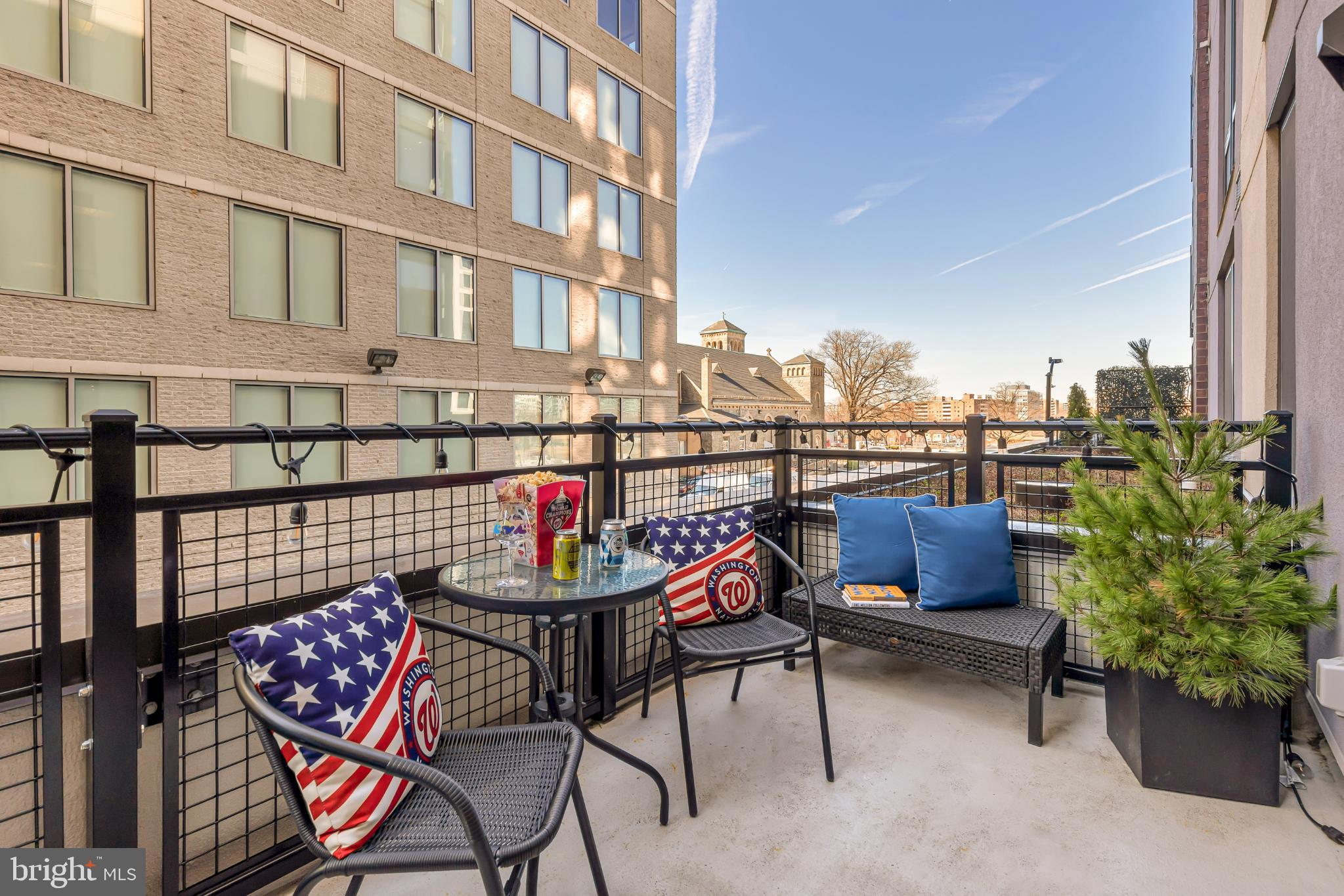 37 L Street Southeast, Unit 308 Washington, DC 20003 - Photo 23 of 43 a view of a chairs and table in the terrace
