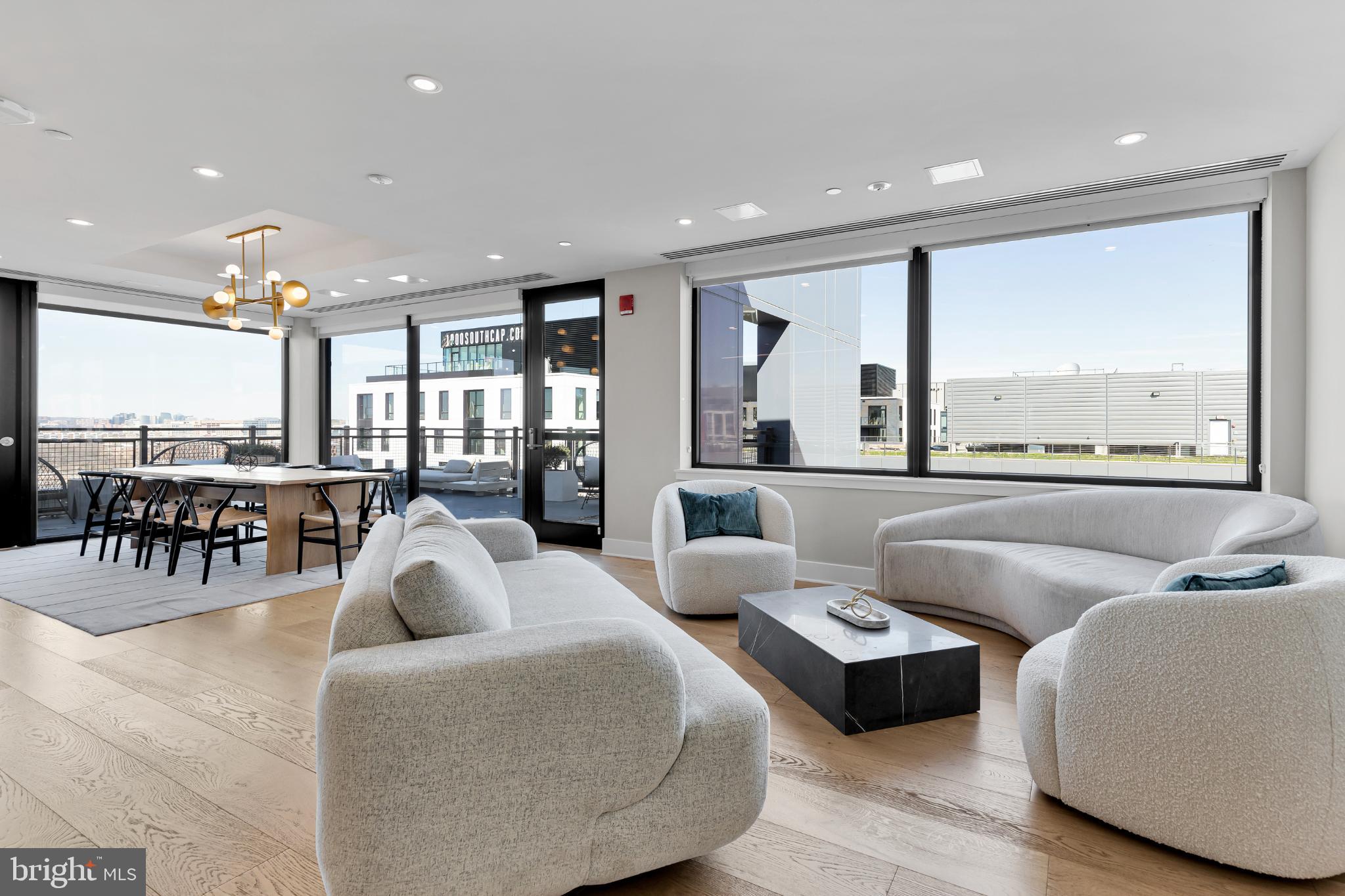 37 L Street Southeast, Unit 308 Washington, DC 20003 - Photo 26 of 43 a living room with furniture and a large window