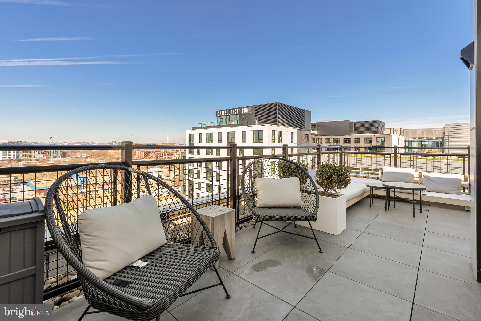 37 L Street Southeast, Unit 308 Washington, DC 20003 - Photo 27 of 43 a view of a terrace with chairs
