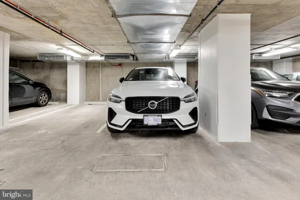 a front view of a building with glass windows and a table