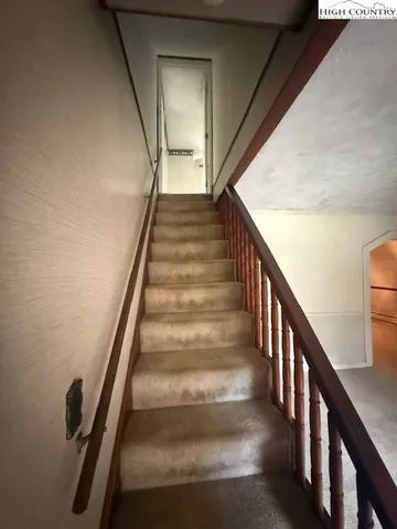 a view of a livingroom with furniture and windows