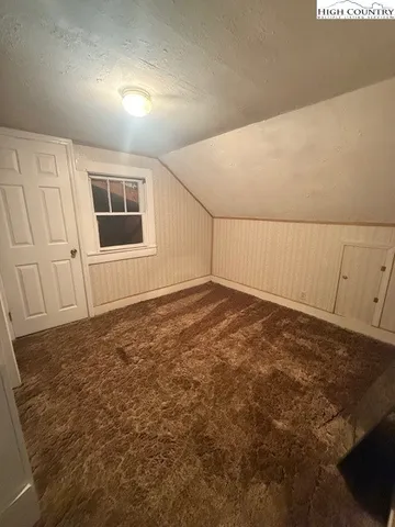 a view of a room with a large window