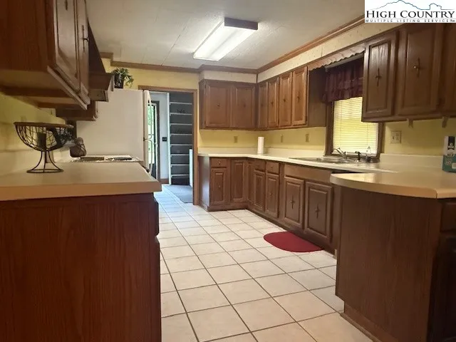 a kitchen with a sink and cabinets