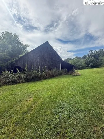 a view of a lake with green space