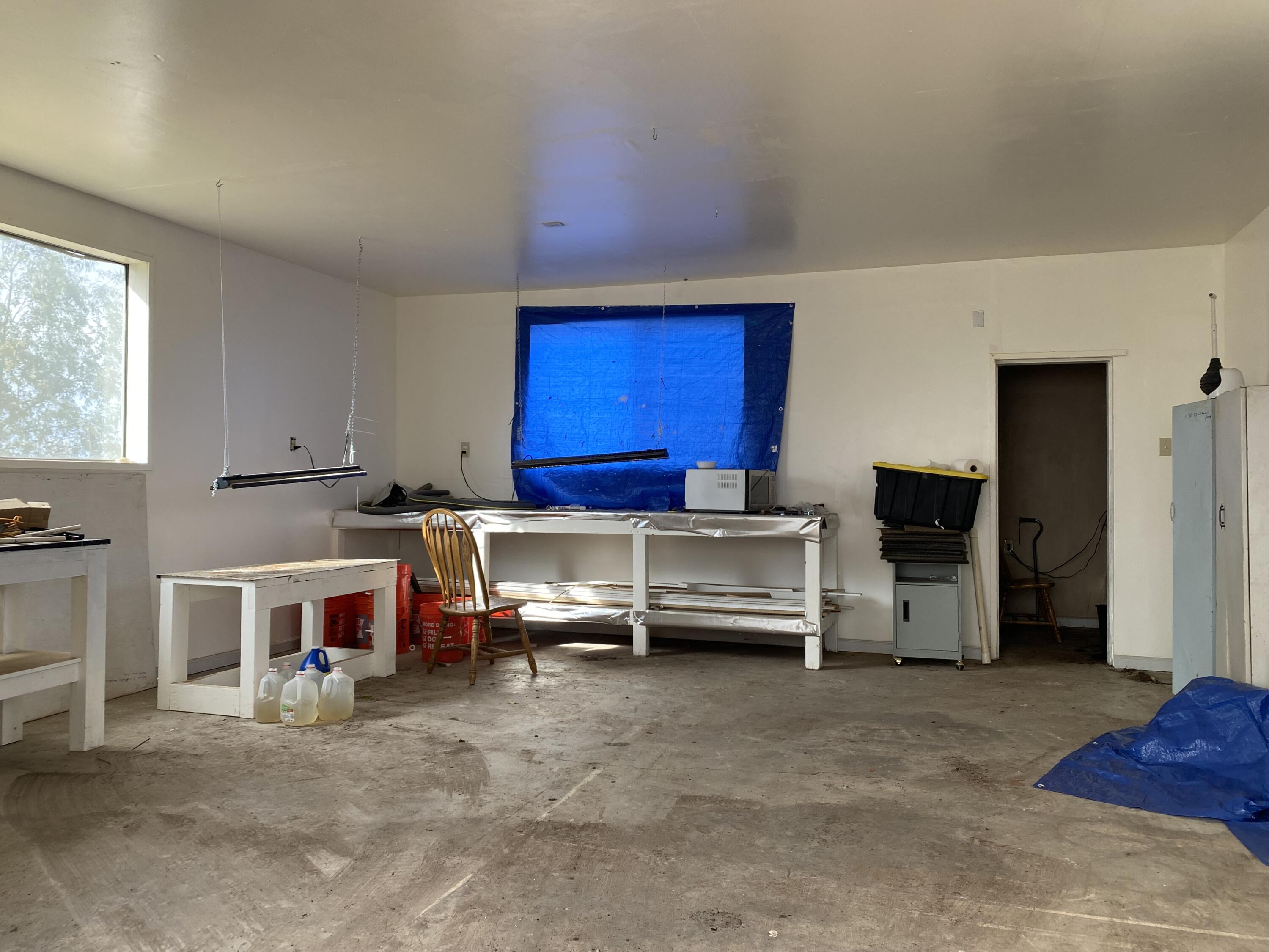 52020 Joshua Tree Road Johnson Valley, CA 92285 - Photo 45 of 48 a living room with furniture a flat screen tv and a refrigerator