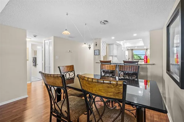 a view of a dining room with furniture and a potted plant