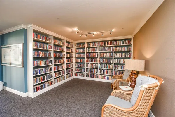 a view of a patio with a table and chairs and potted plants