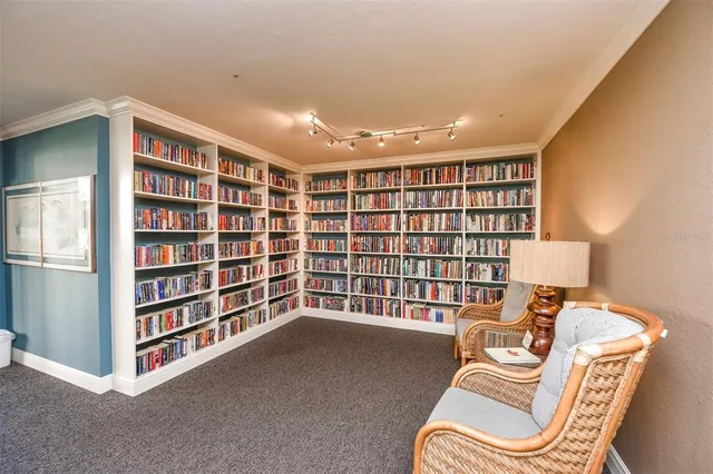 a view of a patio with a table and chairs and potted plants
