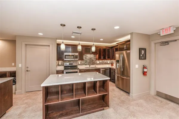 a view of swimming pool from a lounge chair