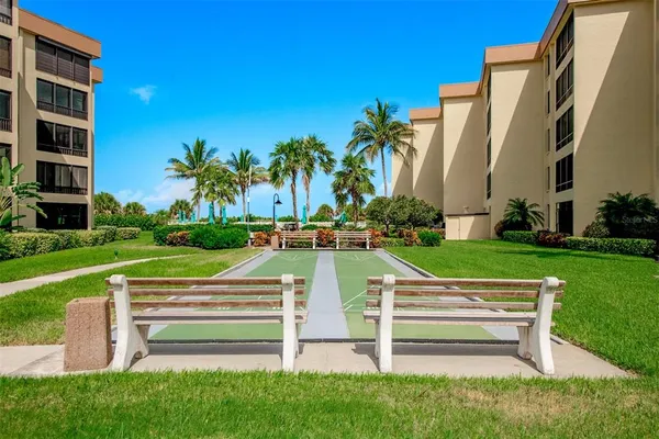 a view of a garden with an outdoor seating