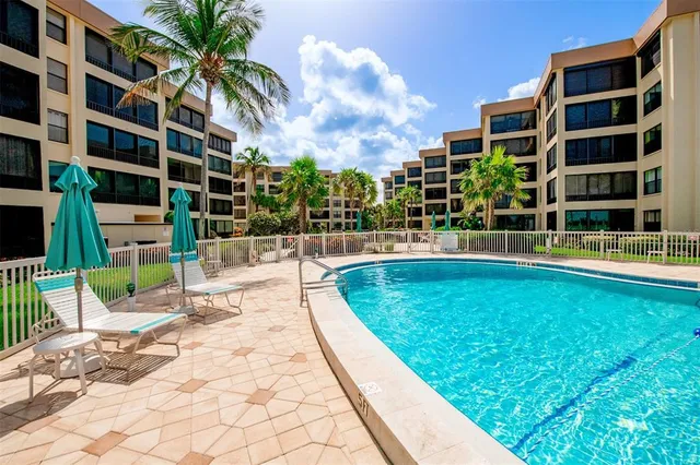 a view of a house with backyard and porch