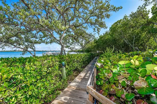 a front view of a house with outdoor seating