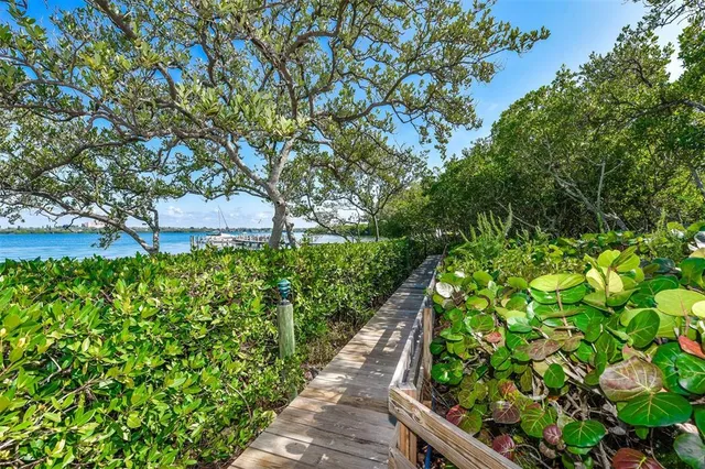 a front view of a house with outdoor seating