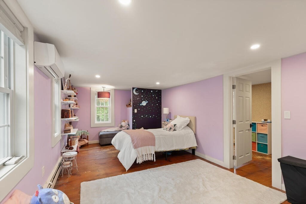 6 Lawrence Road Boxford, MA 01921 - Photo 22 of 42 a bedroom with a bed and wooden floor
