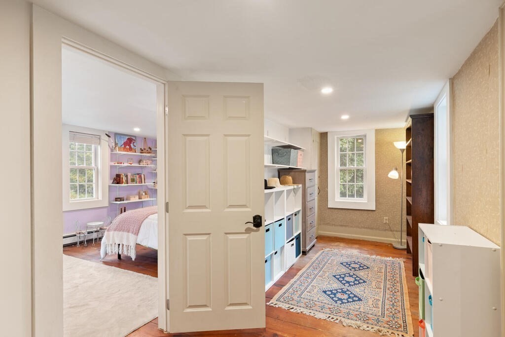 6 Lawrence Road Boxford, MA 01921 - Photo 23 of 42 a bedroom with furniture and a book shelf
