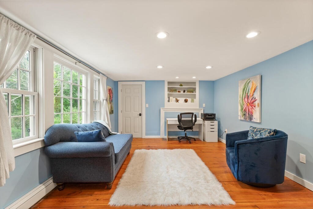 6 Lawrence Road Boxford, MA 01921 - Photo 24 of 42 a living room with furniture and a flat screen tv