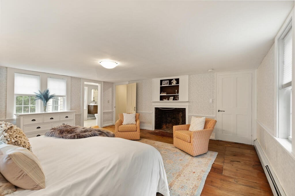 6 Lawrence Road Boxford, MA 01921 - Photo 29 of 42 a spacious bedroom with a large bed and a couch