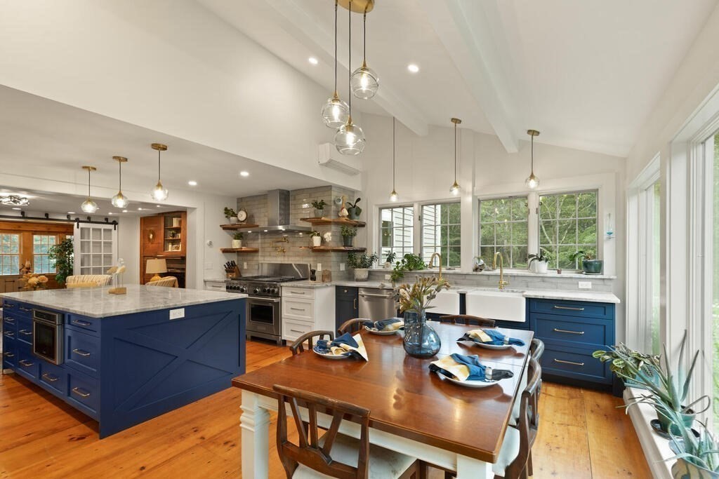 6 Lawrence Road Boxford, MA 01921 - Photo 3 of 42 a room with stainless steel appliances kitchen island granite countertop a table chairs and a wooden floor