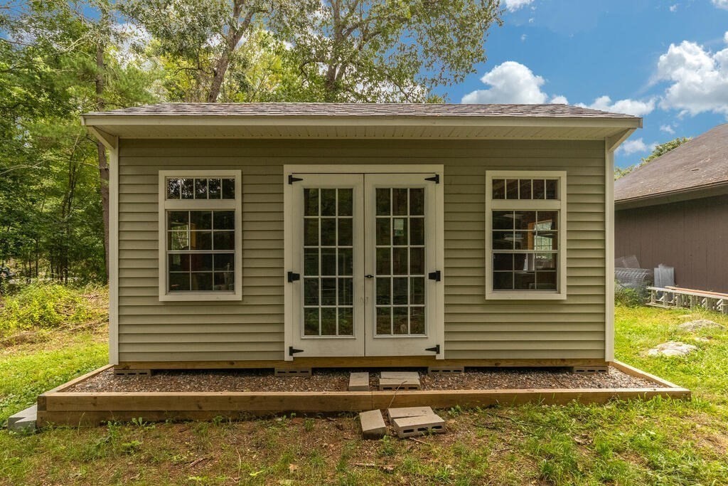 6 Lawrence Road Boxford, MA 01921 - Photo 32 of 42 a front view of a house with a yard