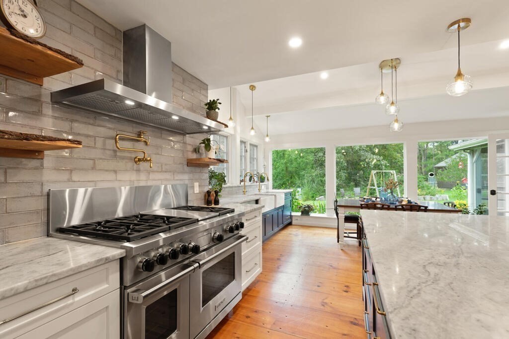 6 Lawrence Road Boxford, MA 01921 - Photo 5 of 42 a kitchen with a stove a sink a window and stainless steel appliances