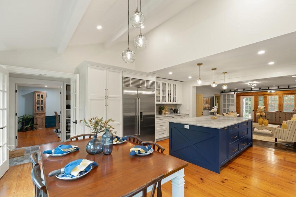 6 Lawrence Road Boxford, MA 01921 - Photo 7 of 42 a kitchen with stainless steel appliances kitchen island granite countertop a sink and refrigerator