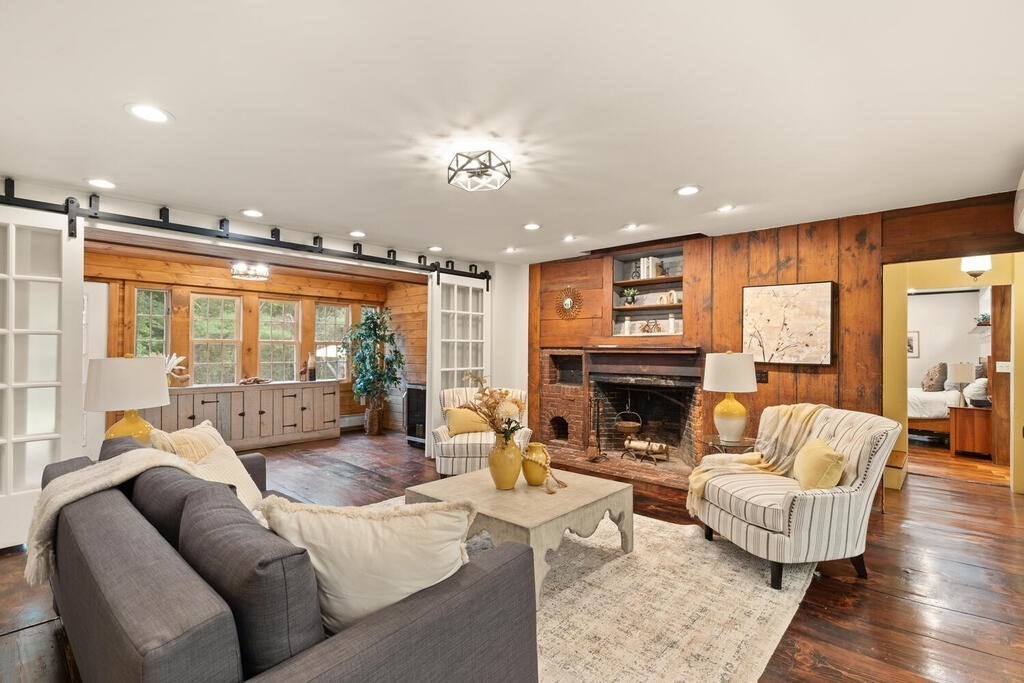 6 Lawrence Road Boxford, MA 01921 - Photo 9 of 42 a living room with fireplace furniture and a large window