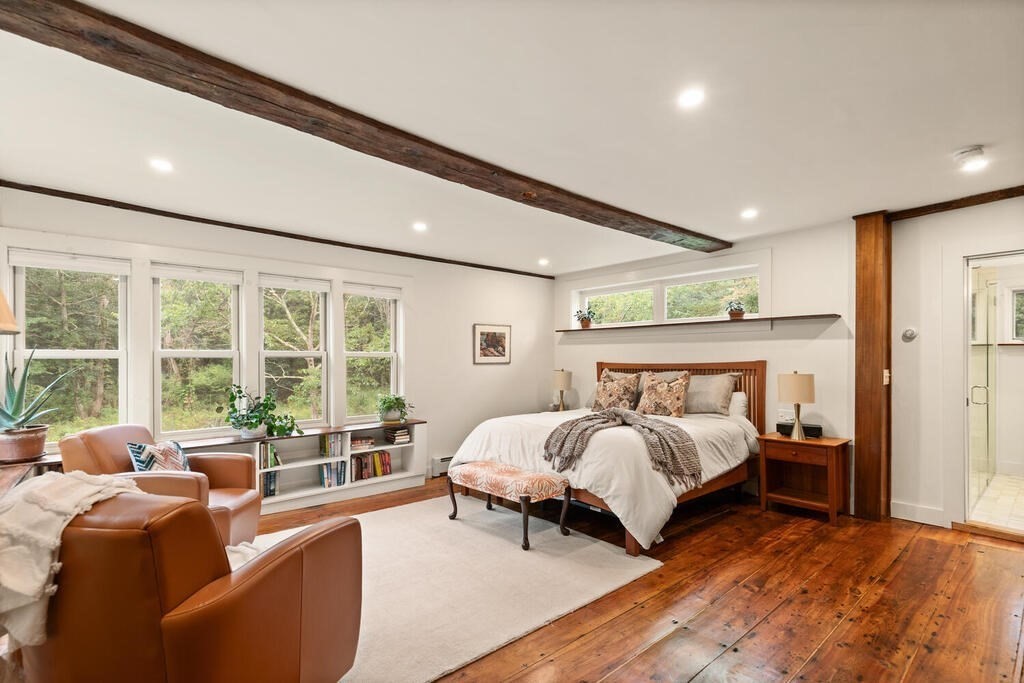 6 Lawrence Road Boxford, MA 01921 - Photo 10 of 42 a spacious bedroom with a bed and a large window