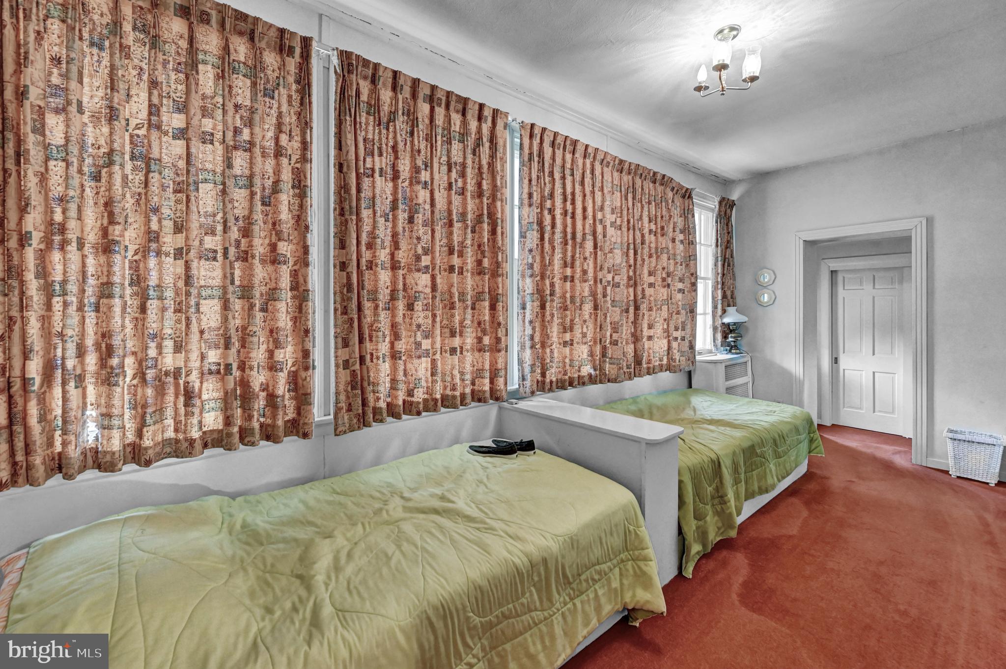 225 Moul Avenue Hanover, PA 17331 - Photo 15 of 81 a bedroom with beds and a chandelier