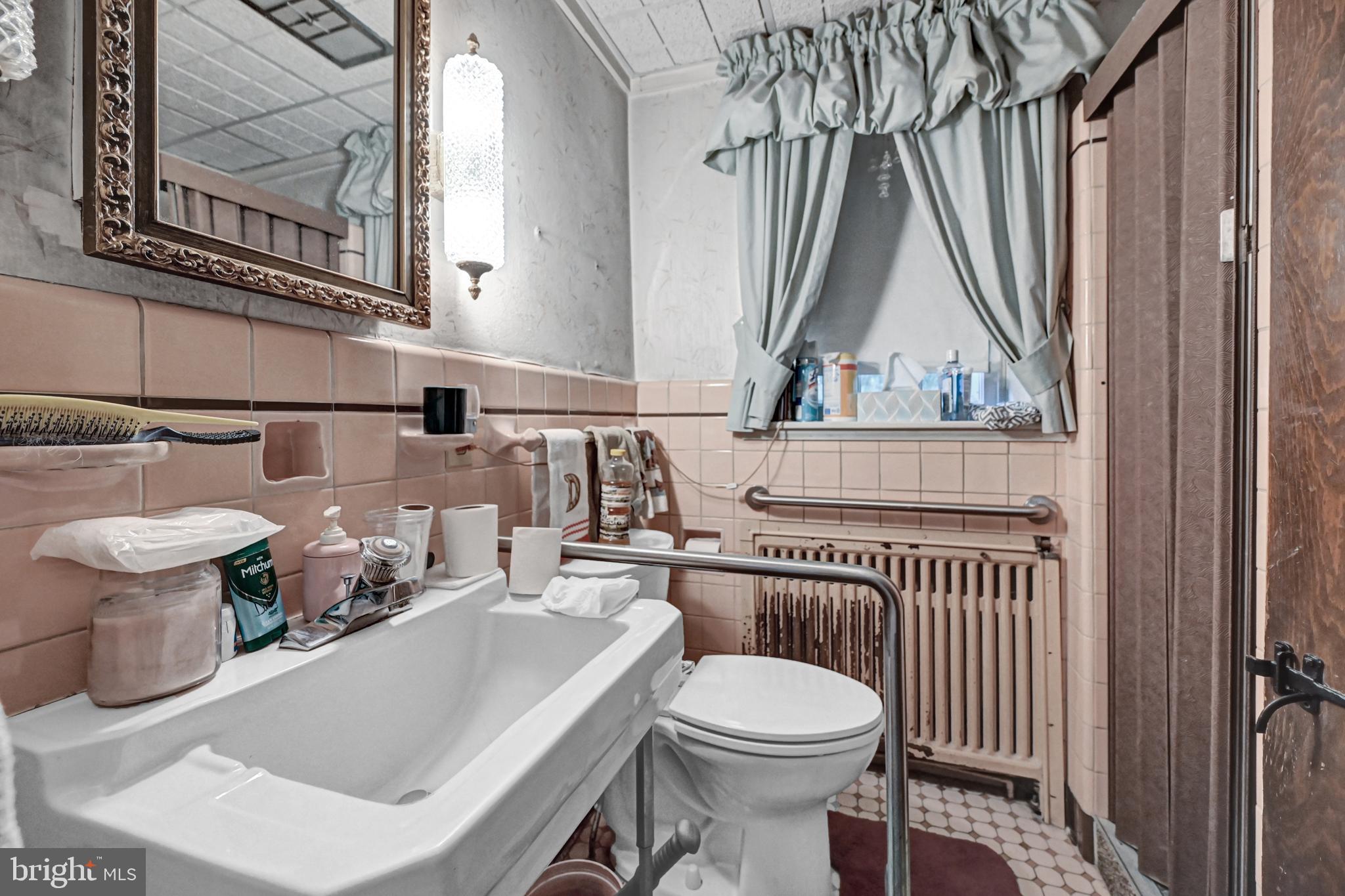 225 Moul Avenue Hanover, PA 17331 - Photo 33 of 81 a bathroom with a toilet a sink and a mirror