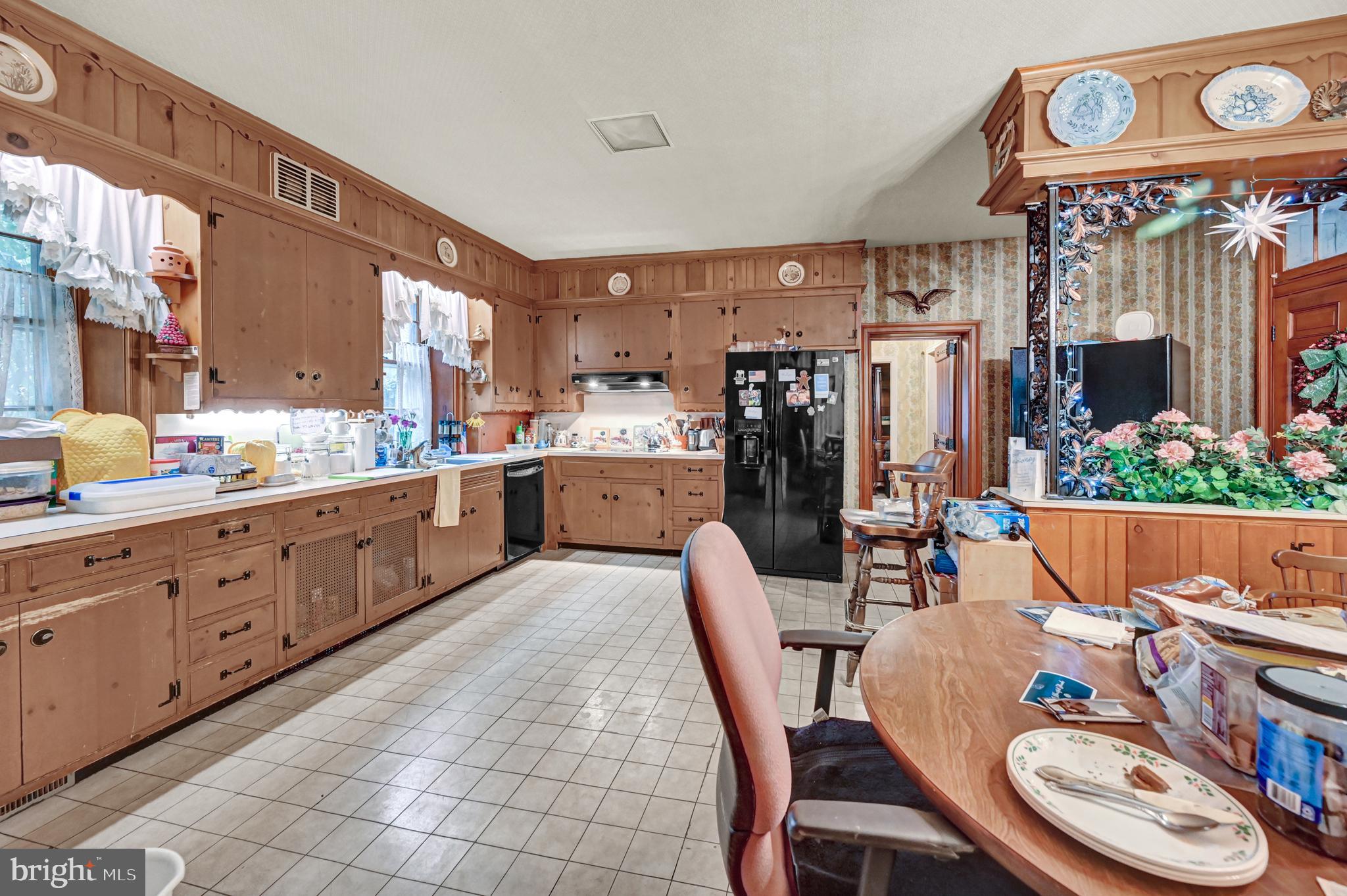 225 Moul Avenue Hanover, PA 17331 - Photo 42 of 81 a kitchen with stainless steel appliances granite countertop a dining table chairs and a refrigerator