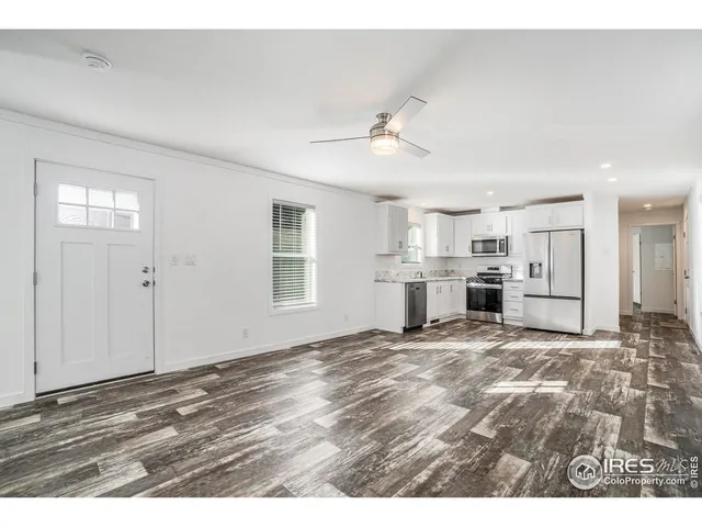 a view of a kitchen with wooden cabinet and a kitchen