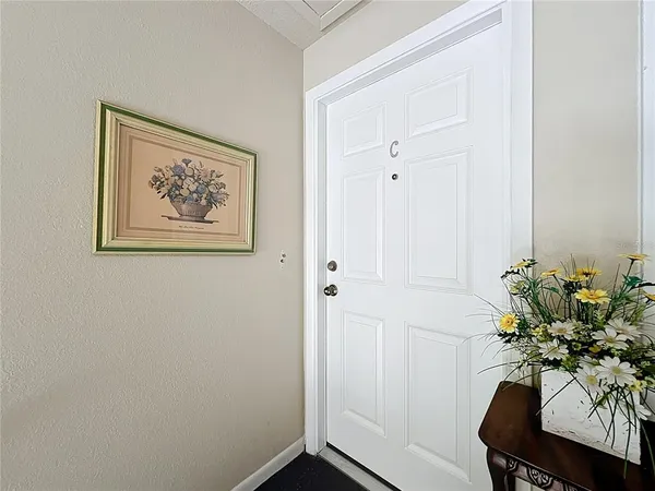 a bedroom with furniture and a chandelier