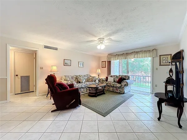 a view of a livingroom with furniture and lounge chair