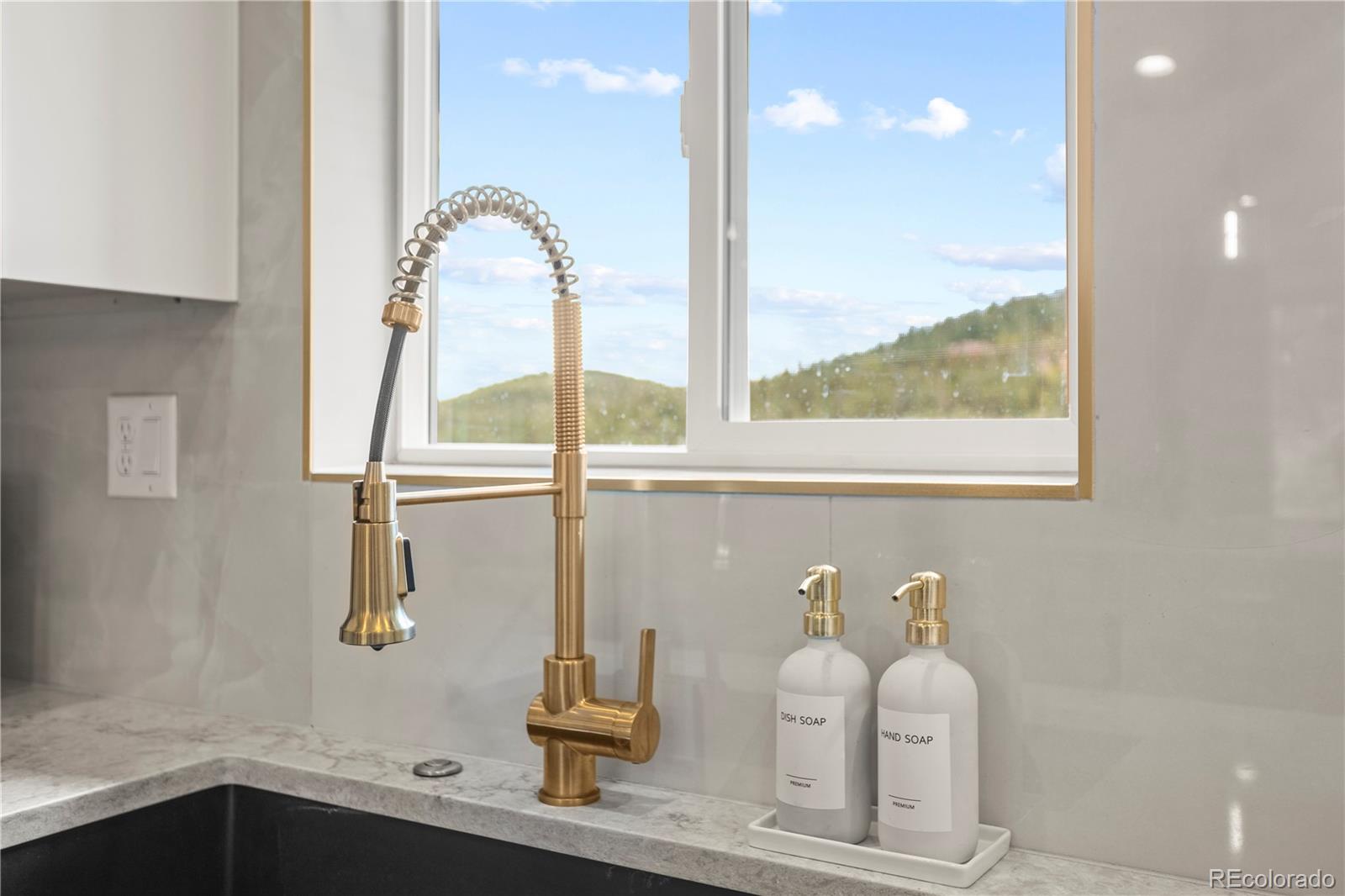 518 Conifer Drive Bailey, CO 80421 - Photo 15 of 50 a bathroom with a sink and a mirror