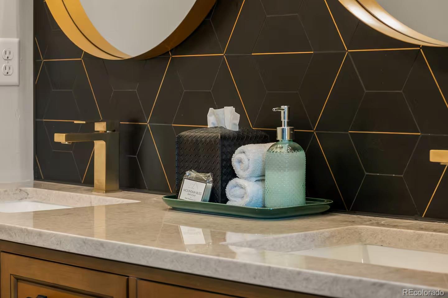 518 Conifer Drive Bailey, CO 80421 - Photo 24 of 50 a bathroom with a sink and a mirror