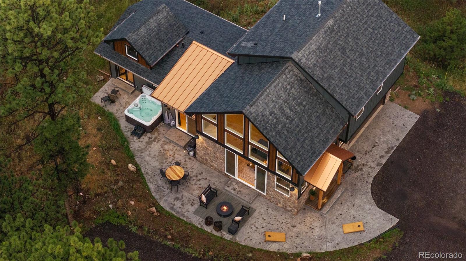 518 Conifer Drive Bailey, CO 80421 - Photo 3 of 50 an aerial view of a house with table and chairs