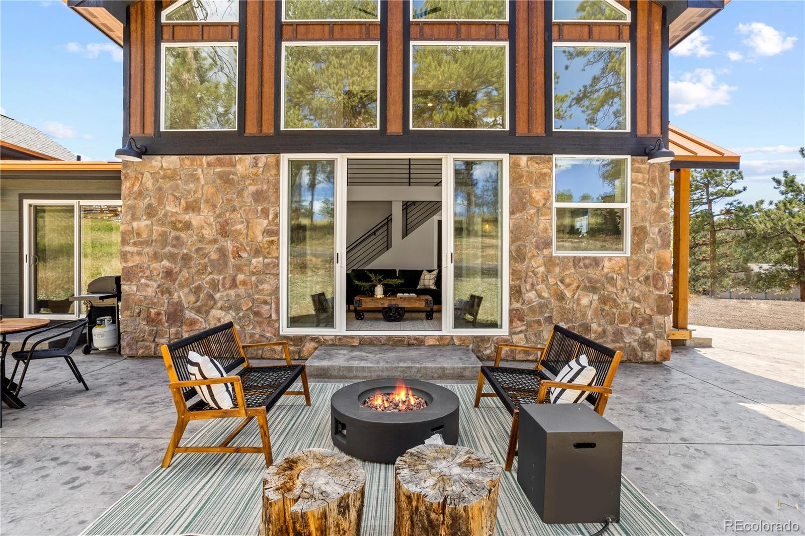 518 Conifer Drive Bailey, CO 80421 - Photo 5 of 50 an outdoor view of house with outdoor seating