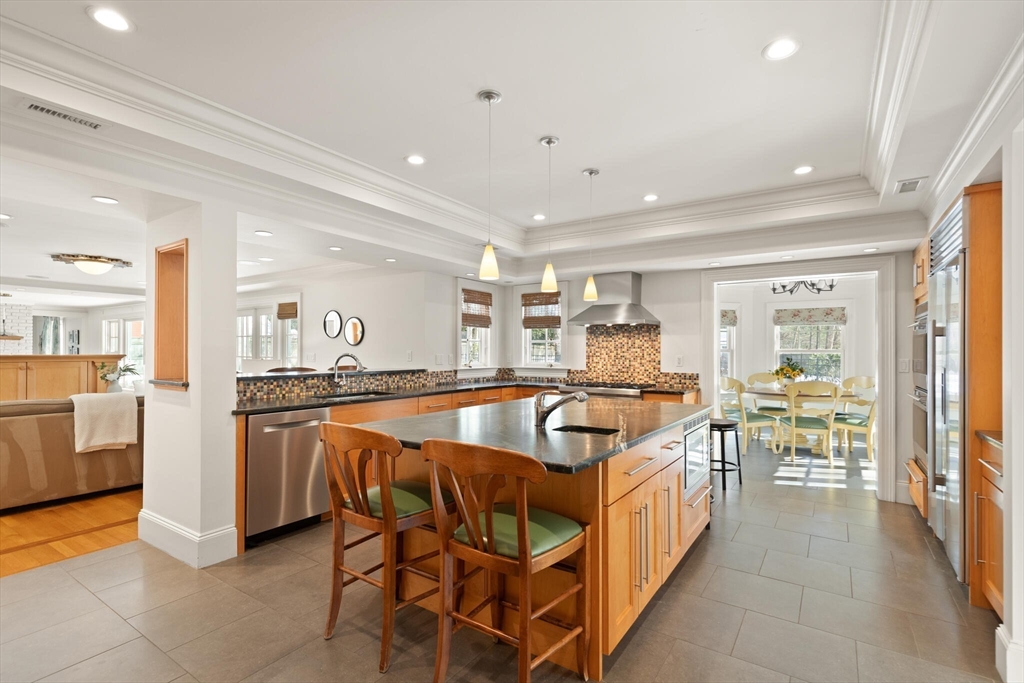 30 Underhill Road Lynnfield, MA 01940 - Photo 16 of 39 a kitchen with stainless steel appliances granite countertop a stove a sink a refrigerator and cabinets